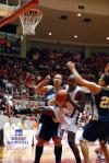 Player of the Year Josephine Owino gets a rebound against her Lambuth University opponent during the championship of the 2009 NAIA tournament. - Photo by Kristi McMurry