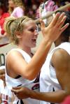 Kayla Hudson gives her teammate a hug after winning the 2009 NAIA championship. - Photo by Kristi McMurry