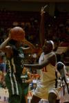 Josephine Owino plays some strong defense in the NAIA tournament semifinals against Oklahoma Baptist University. - Photo by Angela Abbamonte