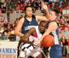 Josephine Owino is involved in a physical exchange with Lambuth players during the NAIA national championship game. - Photo by Morris Abernathy