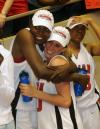 Josephine Owino gives Kayla Hudson a big hug after their victory over Lambuth in the NAIA national championship game. - Photo by Morris Abernathy