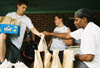 Senior Dave Wolk and Freshman Shaundra Bloomburg give sack lunches to displaced families in East Jackson after the May 5th tornado. - Photo by Justin Veneman