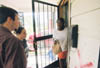 Juniors Jonathan Miller and Melinda Eckley deliver food to a tornado victim in downtown Jackson.
 - Photo by Justin Veneman