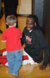Junior forward Greg Truvillion greets a young fan before the TranSouth Conference Championship game. - Photo by Morris Abernathy
