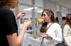 Abby Priddy, junior art major, chats with friends at the annual student art show reception.  - Photo by Kristi McMurry