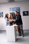 Lee Benson, art department chair, congratulates Kelsey Nagy, sophomore art major, on her scholarship award.  - Photo by Kristi McMurry