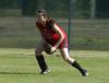 Michelle Albonetti looks to get the ball back to the infield after fielding a base hit to center field. - Photo by Steven Aldridge