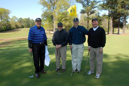 Harold Patrick, John Dancy, Harry Smith and Bob Campbell pose for a photo after finishing a hole at Union's first Roy L. White Golf & Gala golf tournament.