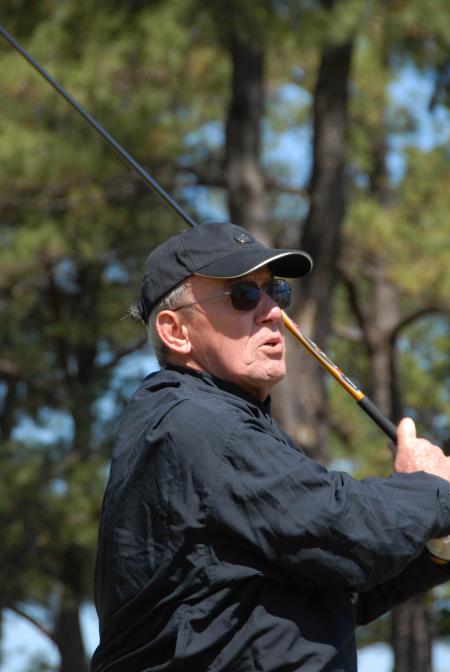 Breakfast speaker John Dancy, former NBC senior correspondent and 1959 Union graduate, follows his ball down the fairway during Union's first Roy L. White Golf & Gala golf tournament.