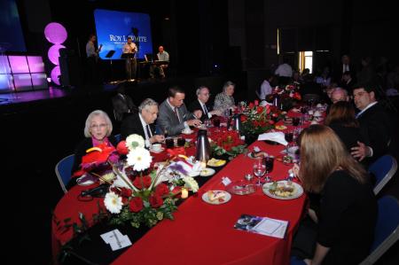 Peyton Manning and the Whites eat dinner just before Manning speaks at the Roy L. White Legacy Golf & Gala gala at the Carl Perkins Civic Center.