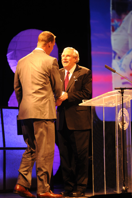 Roy L. White welcomes Peyton Manning to the stage during the Roy L. White Legacy Golf & Gala gala held at the Jackson Civic Center.