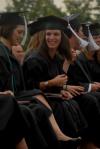 Ashley Diehm smiles at a friend after receiving her BA  in Teaching English As a Second Language during spring graduation. - Photo by Angela Abbamonte