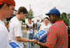 Senior David Wolk, freshman Blakely Rudd, and freshman Shondra Bloomburg give out bottled water to a local tornado victim. - Photo by Justin Veneman