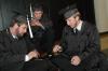 Graduates Kieler Henry, Matthew Lynn and John Henson play finger football while waiting to walk to graduation on Saturday, May 23, 2009. - Photo by Beth Spain
