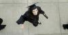 International business graduate Ashley Ennis heads to the Great Lawn for spring graduation. - Photo by Beth Spain