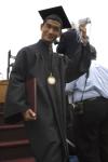 Danny Song transfers his tassel after he receiving his diploma during spring graduation. - Photo by Sarah Palmer