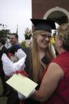 Debra Howell is congratulated by her mother Judy after the spring graduation ceremony. - Photo by Sarah Palmer