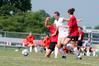 8/19/09 - Steffi King, freshman, dribbles through two Christian Brothers opponents toward the goal.  - Kristi McMurry