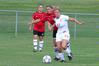8/19/09 - Katelin Dirksen, senior business administration major, dribbles ahead of two Christian Brothers opponents. - Kristi McMurry