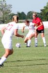 8/19/09 - Steffi King, freshman, keeps the ball away from her Christian Brothers opponent as Katelin Dirksen (27) moves into position. - Kristi McMurry