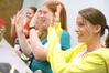 Freshmen Amanda Bennett and Hillary Craft play a game with their Focus group during new student orientation. - Photo by Kristi McMurry