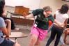 Stephanie Smith plays an icebreaker game with her Focus group during new student orientation. - Photo by Kristi McMurry