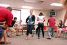 Lily Coursey plays an icebreaker game with her Focus group during new student orientation. - Photo by Kristi McMurry