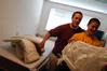 Jeremy Isbell, freshman music major from Jackson, Tenn., and his brother, Kevin, an Union alum, joke while putting a mattress pad onto his new bed. - Photo by Sarah Palmer