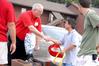 Don Van, professor of engineering, shakes hands with Union parent, David Adkins, while helping students move-in on freshman move-in day. - Photo by Kristi McMurry