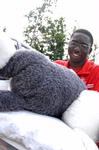Hani Nyabam, senior computer science major, helps an incoming freshman move things into the dorms on freshman move-in day.
 - Photo by Kristi McMurry