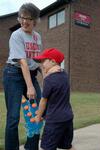 Union education faculty member Dottie Myatt and Daniel Ellsworth, 6, help new students move into the Heritage Complex. - Photo by Beth Spain