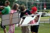 Michael Tankersley (on left), 6, and Daniel Ellsworth, 6, show Zoe Myatt, 7, her reflection as they carry a new student's mirror during move-in day. - Photo by Beth Spain