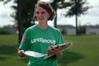 Sarah Brubaker, junior social work major, passes out maps to cars that come the entrances during new student move-in on Friday, August 21, 2009. - Photo by Beth Spain