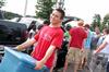 Peter Yu, sophomore, helps move an incoming freshman into their room on freshman move-in day. - Photo by Kristi McMurry