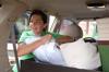Megan Thompson, sophomore, helps unload the car of an incoming freshman on freshman move-in day. - Photo by Kristi McMurry
