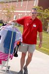 Marc Lockett, assistant biology professor, helps an incoming freshman move things into the dorms on freshman move-in day.
 - Photo by Kristi McMurry