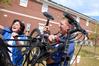 Lance and Marilyn Bennett, parents of incoming freshman Amanda Bennett, unload their daughter's bike on freshman move-in day. - Photo by Kristi McMurry