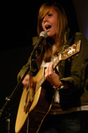Freshman Kelsey Meadows performs an original song for the Focus Open Mic during new student orientation. - Photo by Sarah Palmer