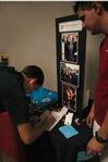 Freshman Matthew Cox signs up on the Department of Music interest list after talking with Jamie Evans, senior music education major, at the organization fair.      - Photo by Sarah Palmer