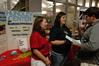 Libby Ford, senior accounting major, and Abby McBroom, senior nursing major, speak to Freshman Andy McBroom about the Hundley Center for Academic Enrichment at the organization fair. - Photo by Sarah Palmer