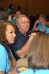 Michael Chute, professor of communication arts, talks with incoming freshmen who are interested in the communication arts department during new student orientation. - Photo by Kristi McMurry