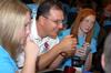 Michael Salazar, associate professor of chemistry, talks with incoming freshmen, such as Lynnsey Park and Stephanie Morris, who are interested in the chemistry department during new student orientation. - Photo by Kristi McMurry
