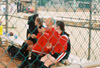 (L to R) Sara Batey, Mary Kosco, and Melissa McCue at the 2003 NAIA Softball World Series in Decatur, Ala. versus the University of Mary. - Photo by Steven Aldridge