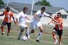 Rafael Carvalho, sophomore business administration major, and Kemal Gogic, freshman, keep the ball away from their Brewton Parker opponents. - Photo by Kristi McMurry