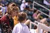 Karen Miller, associate professor of accounting, enjoys a Diamond Jaxx baseball game at Pringles Park during college night. - Photo by Kristi McMurry