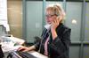 Lana Massey makes a call from her desk at Union Station. Massey is leaving Union after 13 years of service. - Photo by Kristi McMurry