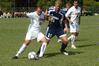 Dejan Kostic holds off a Reinhardt defender in a match on Sept. 12 - Photo by Sarah Palmer