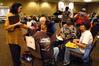 Theresa Blakely, associate professor of social work, acts as a rent collector during the Poverty Simulation in The Grant Center. - Photo by Sarah Palmer