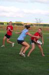 The Onions, an independent intramural team, battle it out with their Zeta opponents in an ultimate frisbee game. - Photo by Kristi McMurry