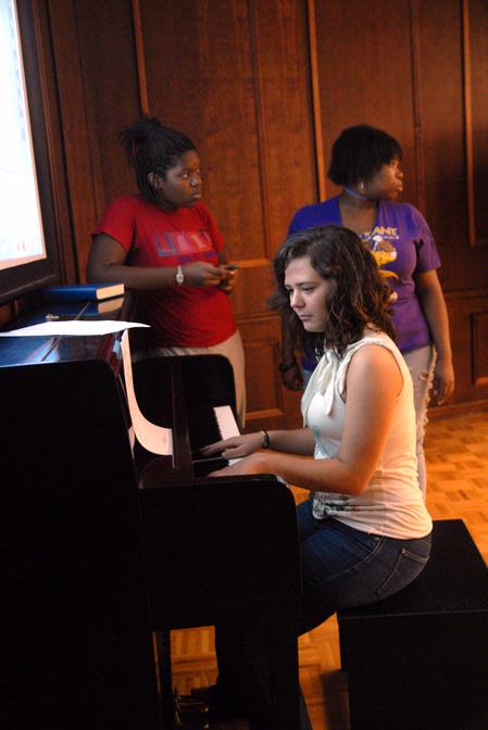 Megan Thompson, sophomore, goes over a new song for the MOSAIC Choir.